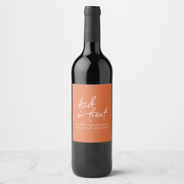Trick or Treat Halloween Party Gift Orange Script Wine Label (Front)