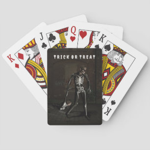 Trick or Treat. Man dressed as skeleton Playing Cards