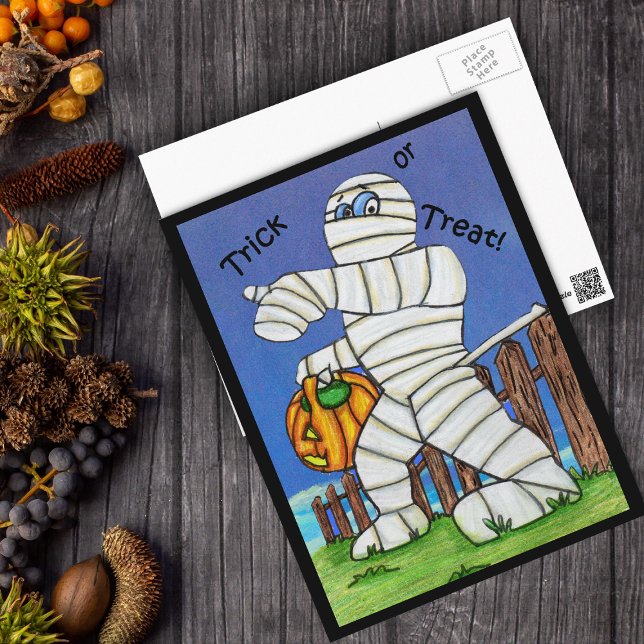 Trick or Treat Mummy Postcard (Silly Mummy caught on wooden fence with pumpkin on Trick or treat postcard with black border.)
