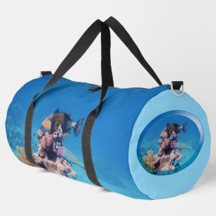 Triggerfish rests on a coral block at coral reef   duffle bag