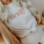 TRIXIE Retro 70's Themed Blush and Orange Bride T-Shirt<br><div class="desc">This bride bachelorette t shirt features a retro 70's themed font in blush and orange colouring. Order the white bride option for the bride-to-be and the coordinating orange 'babe' shirts for your bachelorette group. Colours are editable! Click 'edit design' to create your own colours.</div>