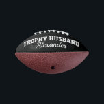 Trophy Husband mini football gift for married men American Football<br><div class="desc">Trophy Husband mini football gift for married men. Cute personalised ball for future husband, groom to be, husband, soon to be married guy etc. Cool quote sports accessory for him. Make your own fun keepsake. Humourous present for wedding party, bachelor party, engagement, bachelorette party, birthday, honeymoon etc. Customisable in different...</div>