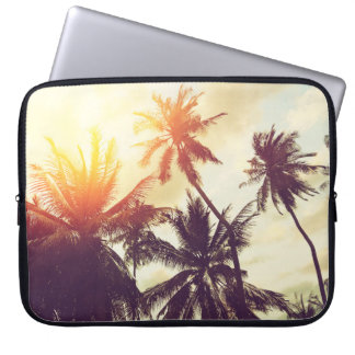 Tropical beach background with palm trees silhouet laptop sleeve