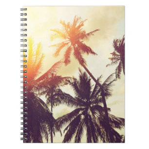Tropical beach background with palm trees silhouet notebook