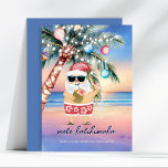 Tropical Beach Palm Tree Santa Christmas Holiday Card<br><div class="desc">Escape to a tropical paradise this holiday season! 🌴🎅 This festive Christmas card features a twilight beach scene with a decorated palm tree glowing with lights and ornaments under a starlit sky. Santa is on vacation and having fun, sipping a pineapple cocktail as the ocean sunset sparkles behind him. The...</div>