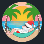 Tropical Beach Santa Palm Tree Christmas Classic Round Sticker<br><div class="desc">Coastal theme Christmas holiday stickers (or envelope seals) feature Santa relaxing in a hammock on a tropical beach,  enjoying the ocean waves and a colourful sunset and festive palm trees decked out in string lights. Original artwork KL Stock.</div>