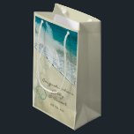 Tropical Beach Wedding Congratulations Small Gift Bag<br><div class="desc">Fill the pretty and personalised Tropical Beach Wedding Congratulations Gift Bags with your present for the newlyweds. These custom tropics theme wedding congrats bags feature a nature photograph of a turquoise aqua blue ocean and sand shore with a palm tree and teal swirls adorning the corner. Perfect for a classy...</div>