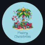 Tropical Christmas Palm Tree Classic Round Sticker<br><div class="desc">Christmas stickers with a seasonal holiday image. A tropical palm tree decorated in festive lights with a star on top. A giant red and white candy cane sticking out of the sand. Christmas presents under the tree. Whimsical and fun.</div>