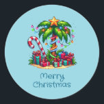 Tropical Christmas Palm Tree Classic Round Sticker<br><div class="desc">Christmas stickers with a seasonal holiday image. A tropical palm tree decorated in festive lights with a star on top. A giant red and white candy cane sticking out of the sand. Christmas presents under the tree. Whimsical and fun.</div>