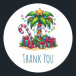 Tropical Christmas Palm Tree Thank You Classic Round Sticker<br><div class="desc">Thank you stickers with a seasonal holiday image. A tropical palm tree decorated in festive lights with a star on top. A giant red and white candy cane sticking out of the sand. Christmas presents under the tree. Whimsical and fun.</div>