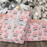 Tropical Flamingo Christmas Wrapping Paper<br><div class="desc">Celebrate the holidays with a bit of surf and sand with this festive wrapping paper featuring three pink flamingos wearing Santa hats and ornament accents at the base. Wish your loved ones a happy holiday season in beachy style. Whether you live in a beach or tropical location like Florida, Hawaii,...</div>