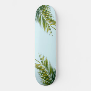 Tropical Green Palm Frond on Light Blue Skateboard