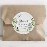 Tropical Green Spanish Thank You Wedding Favour Classic Round Sticker<br><div class="desc">This tropical green Spanish thank you wedding favour classic round sticker is perfect for a modern wedding. The design features hand-painted beautiful green leaves, adorning a gold geometric frame. Make the sticker labels your own by including your names, the event (if applicable), and the date. These stickers can compliment a...</div>