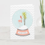 Tropical Island Flamingo Christmas - Pink Holiday Card<br><div class="desc">A winter / Christmas card featuring an illustration of a pink flamingo inside a snowglobe.  
Flamingo is wearing a red striped scarf and hat while perched on a snow covered island with two palm trees.  Pink base says,  "WARM WISHES."  Background is grey chevron.</div>