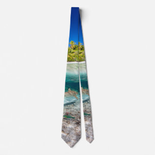 Tropical island under and above water tie