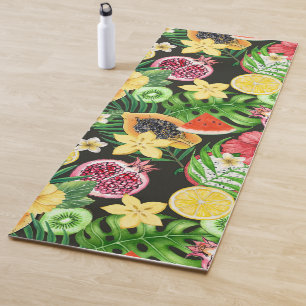 Tropical mix-fruit, flowers and leaves on black yoga mat