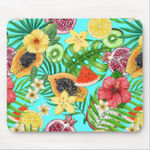 Tropical mix-fruit, flowers and leaves on blue mouse mat
