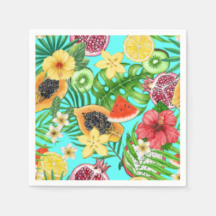 Tropical mix-fruit, flowers and leaves on blue napkin