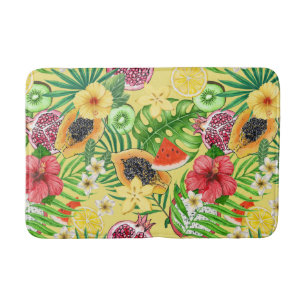 Tropical mix-fruit, flowers and leaves on yellow bath mat