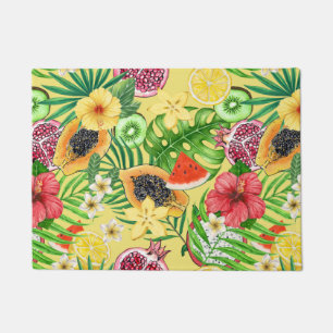 Tropical mix-fruit, flowers and leaves on yellow doormat
