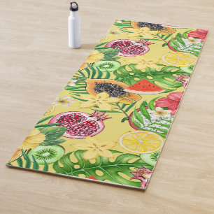 Tropical mix-fruit, flowers and leaves on yellow yoga mat