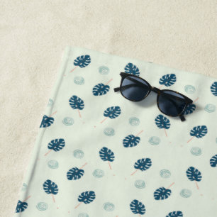Tropical monstera leaves monogram on blue beach towel