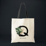 Tropical Monstera Letter Q Monogram Bridesmaid Tote Bag<br><div class="desc">Customizable letter Q monogram tote bag featuring watercolor tropical monstera leaf,  faux gold foil leaf and black watercolor brush accents. Personalize this tropical monogram tote bag by adding your name or other details. This boho letter Q monogram bag will be perfect as a gift. Other letters are available.</div>