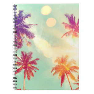Tropical palm tree with colorful bokeh sun light o notebook