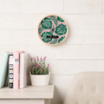 Tropical Pink & Green Palm Leaves Pattern & Name Clock<br><div class="desc">The Tropical Pink & Green Palm Leaves pattern is a vibrant and lively design that incorporates elements of nature and a tropical aesthetic. The pattern features lush palm leaves in shades of pink and green, creating a striking contrast and an overall eye-catching appearance.Overall, the Tropical Pink & Green Palm Leaves...</div>