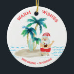 Tropical Surfing Santa Beach Warm Wishes Christmas Ceramic Tree Decoration<br><div class="desc">Santa is taking a much needed vacation and is living the good life, surfing and relaxing on a tropical island beach. He's got his toes in the sand, a drink in his hand, palm trees and a warm ocean breeze. "Warm Wishes" greeting is in a pretty coral colour across the...</div>