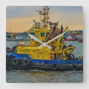 Tugboat sailing at river, montevideo, uruguay square wall clock