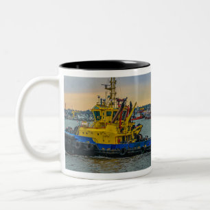 Tugboat sailing at river, montevideo, uruguay Two-Tone coffee mug