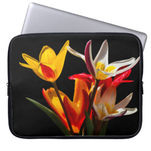 Tulip flowers against black background laptop sleeve