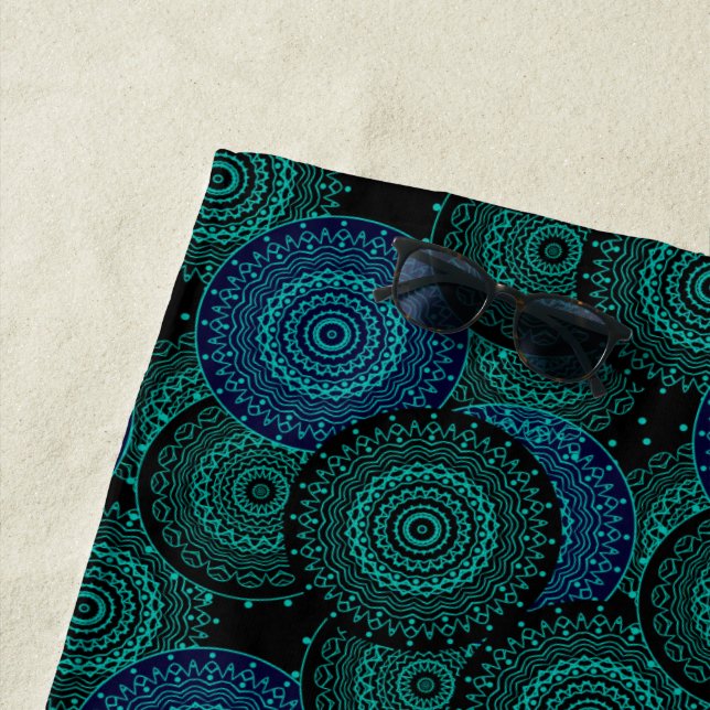 Turquoise blue round mandala on black background beach towel (In Situ)