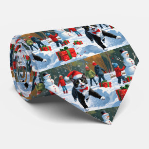 Tuxedo Cat Running in Snow with Christmas Hat Tie