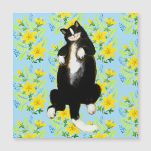 Tuxedo cat Sleeping on floral bed