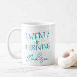 TWENTY & THRIVING 20th Birthday Funny Personalised Coffee Mug<br><div class="desc">Celebrate turning twenty in style with this vibrant TWENTY & THRIVING birthday mug featuring bold turquoise lettering. This custom name coffee mug makes a fun and thoughtful gift for anyone embracing their twenties with confidence and energy. A perfect keepsake for morning coffee, dorm life, or birthday brunch. Also available in...</div>