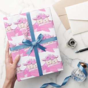 Twin baby girls in Present wrapping paper