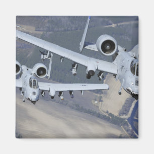 Two A-10C Thunderbolt II aircraft fly in format Magnet