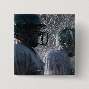 Two American football players in rain, side view 15 Cm Square Badge