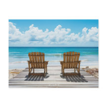 Two beach chairs facing the sea