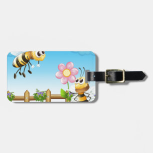 Two bees inside the wooden fence luggage tag