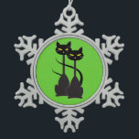 Two Black Cats with Long Necks on Green Snowflake Pewter Christmas Ornament<br><div class="desc">This pewter snowflake Christmas tree ornament features a graphic of two black cats with yellow eyes,  tall necks,  and long tails to look like the letter H for Halloween. The background is a bright green and can be changed by choosing the customise it button.</div>
