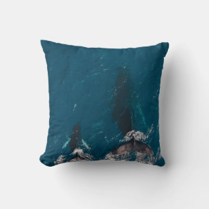 TWO BLACK WHALES SWIMMING IN BODY OF WATER CUSHION