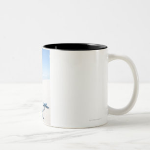 Two blue starfish at water's edge on tropical Two-Tone coffee mug