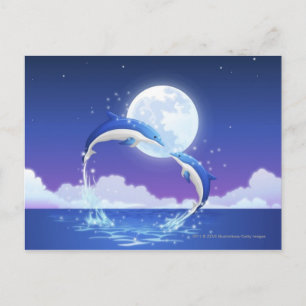 Two bottle-nosed dolphins jumping out of water postcard