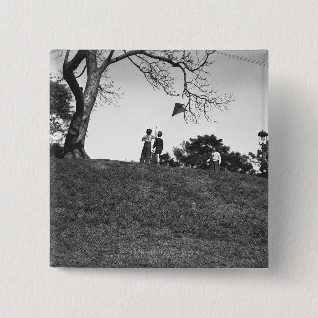 Two boys flying kite on hill B&W 15 Cm Square Badge (Front)
