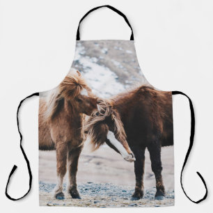 TWO BROWN HORSES ON FIELD APRON