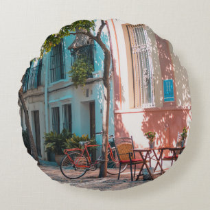 Two brown table outside round cushion