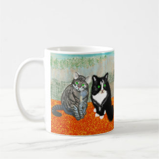 Two cats share your coffee break mug